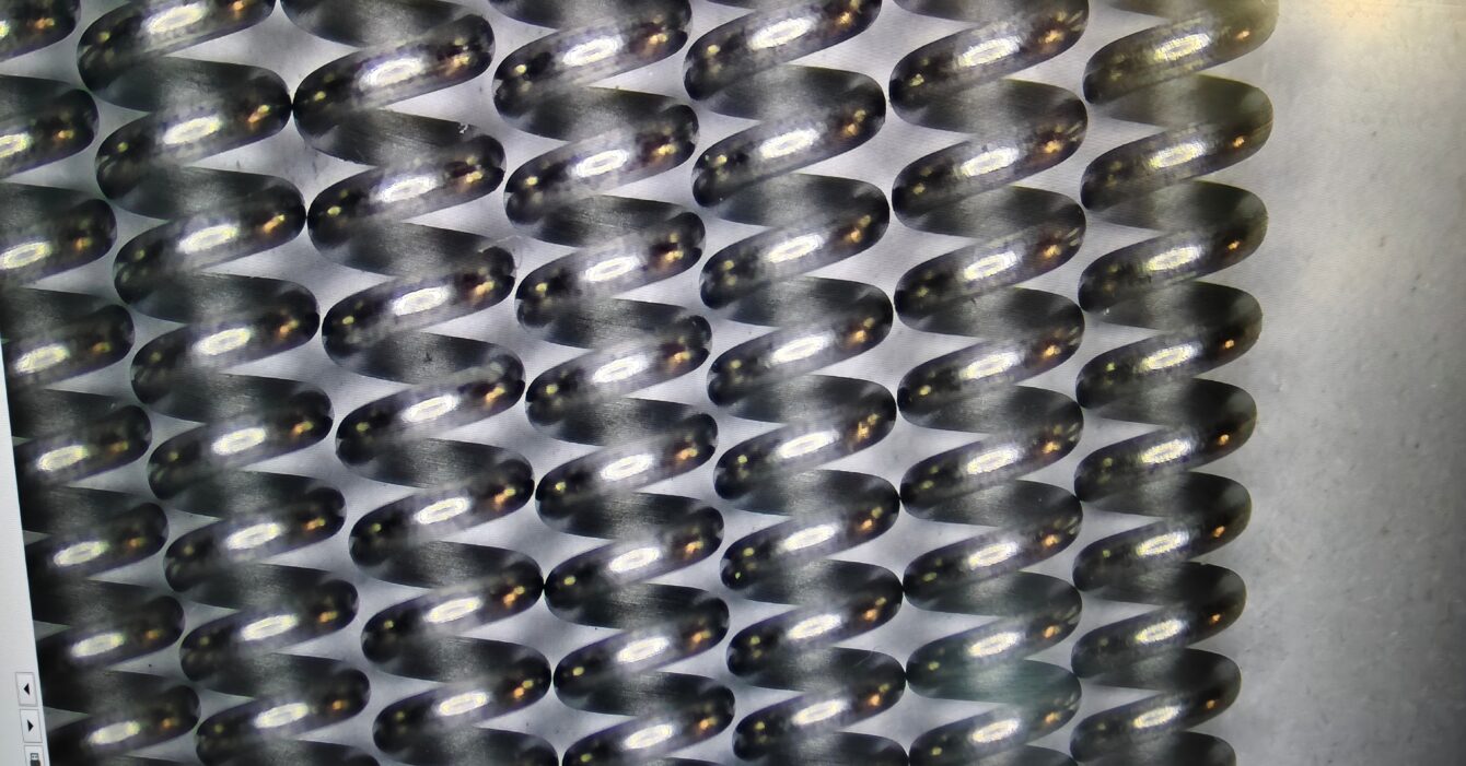 A nitinol spring is a smart metal component made from nickel and titanium alloy A nitinol spring is a smart metal component made from nickel and titanium alloy