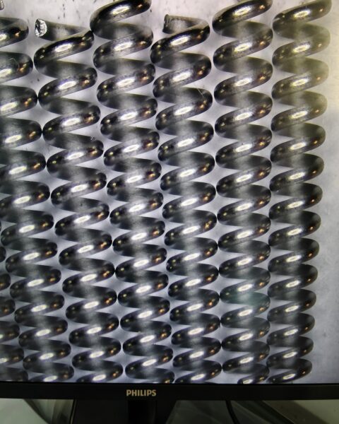 A nitinol spring is a smart metal component made from nickel and titanium alloy