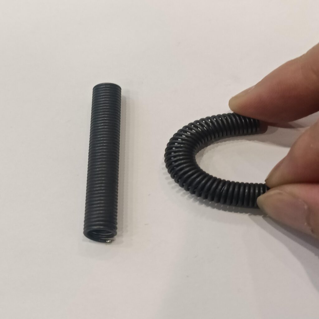Superelastic Nitinol spring demonstrating large elastic deformation